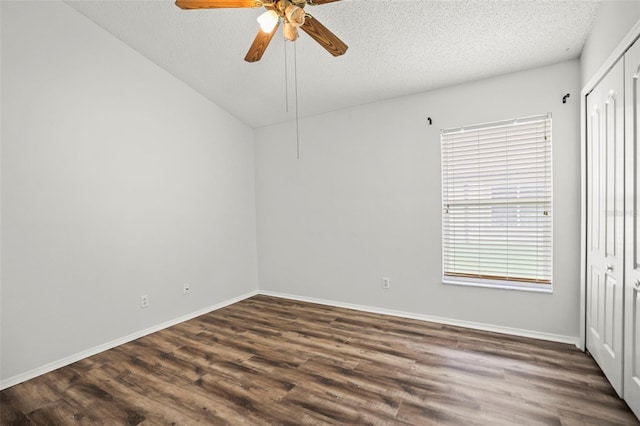 4948 Ridgemoor Cir, Palm Harbor, FL 34685 - empty room featuring ceiling fan, dark wood-style floors, and a textured ceiling