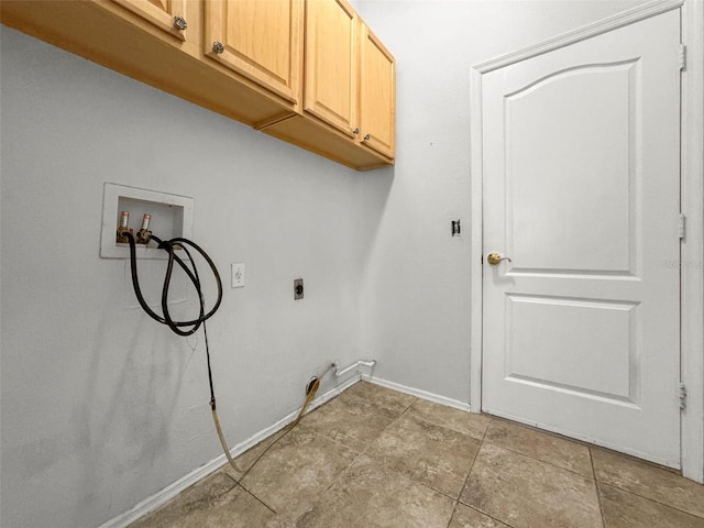 4948 Ridgemoor Cir, Palm Harbor, FL 34685 - washroom featuring cabinet space, washer hookup, electric dryer hookup, and light tile patterned floors