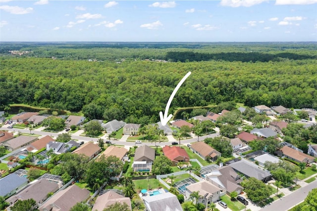 4948 Ridgemoor Cir, Palm Harbor, FL 34685 - aerial view of property and surrounding area featuring a heavily wooded area and nearby suburban area