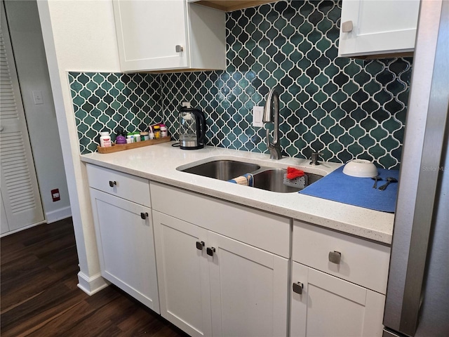 5925 Terrace Park Dr N Unit 210, Saint Petersburg, FL 33709 - kitchen with tasteful backsplash, white cabinetry, and dark wood-type flooring