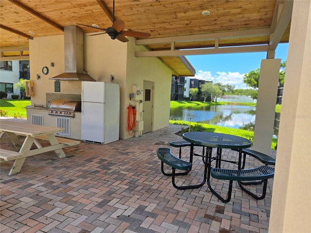 5925 Terrace Park Dr N Unit 210, Saint Petersburg, FL 33709 - view of patio with area for grilling, a water view, outdoor dining area, and a ceiling fan