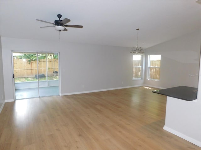 2114 Intervista Ln, Valrico, FL 33594 - unfurnished room featuring a chandelier, light wood-style floors, and a ceiling fan