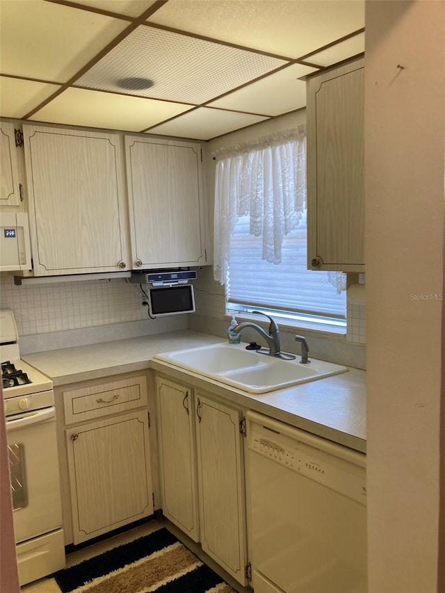 5623 80th St N Unit 314, Saint Petersburg, FL 33709 - kitchen with white appliances, light countertops, and tasteful backsplash