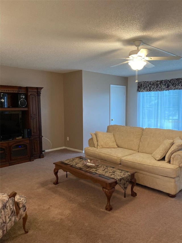 5623 80th St N Unit 314, Saint Petersburg, FL 33709 - carpeted living area featuring a textured ceiling and a ceiling fan
