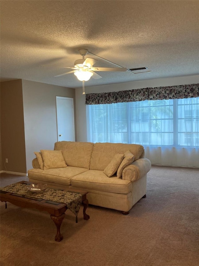 5623 80th St N Unit 314, Saint Petersburg, FL 33709 - carpeted living area with a textured ceiling and a ceiling fan
