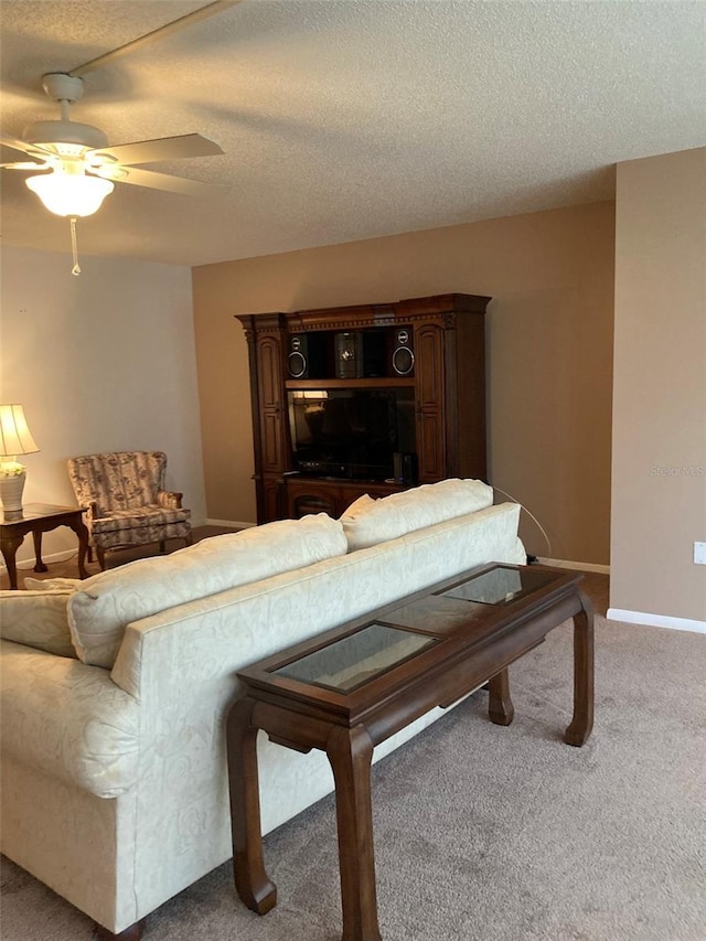 5623 80th St N Unit 314, Saint Petersburg, FL 33709 - carpeted living area featuring a ceiling fan and a textured ceiling