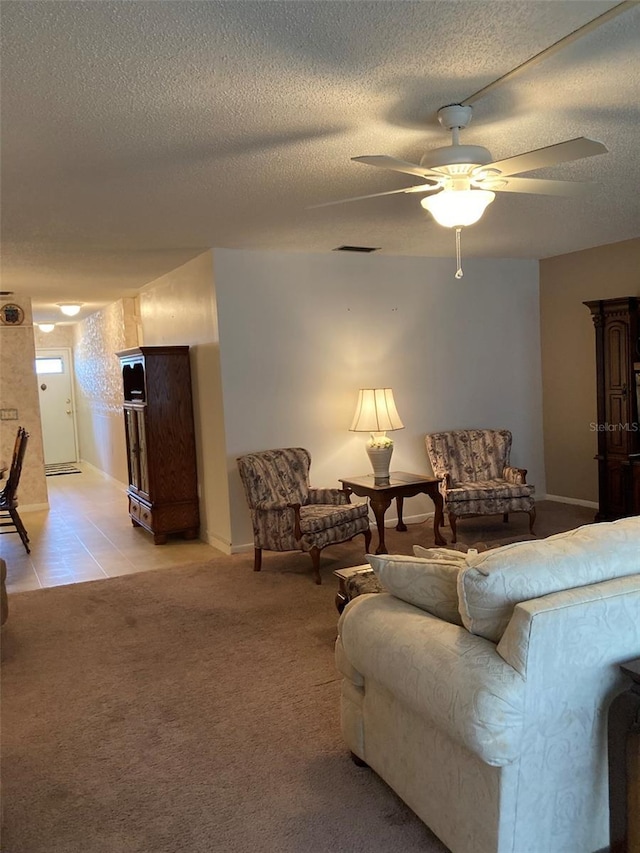 5623 80th St N Unit 314, Saint Petersburg, FL 33709 - living area featuring ceiling fan, a textured ceiling, light carpet, and light tile patterned flooring