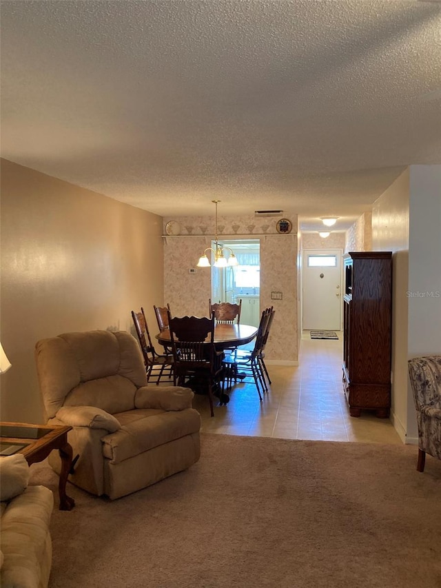 5623 80th St N Unit 314, Saint Petersburg, FL 33709 - living area with a textured ceiling, light tile patterned floors, and a chandelier