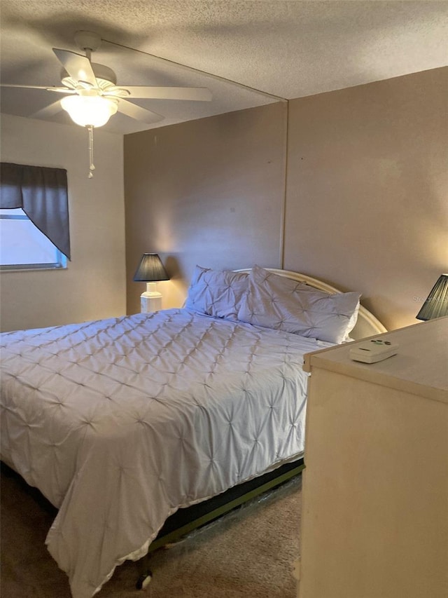 5623 80th St N Unit 314, Saint Petersburg, FL 33709 - bedroom featuring carpet floors, a ceiling fan, and a textured ceiling