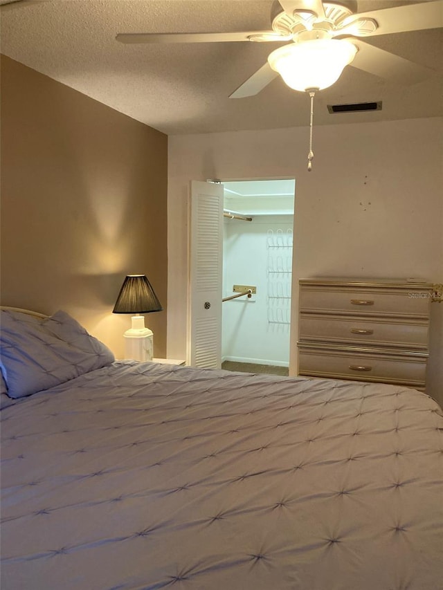 5623 80th St N Unit 314, Saint Petersburg, FL 33709 - bedroom with a ceiling fan, a textured ceiling, and a closet