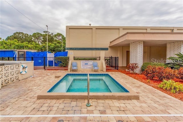 5623 80th St N Unit 314, Saint Petersburg, FL 33709 - view of pool featuring a community hot tub and a swimming pool