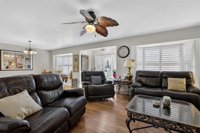 210 Jayview Ave, Lehigh Acres, FL 33936 - living area with ceiling fan, wood finished floors, and a chandelier
