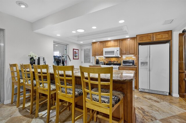 210 Jayview Ave, Lehigh Acres, FL 33936 - dining area with recessed lighting and a tray ceiling