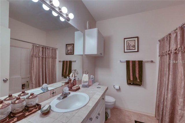 2733 Via Cipriani Unit 830B, Clearwater, FL 33764 - bathroom with a shower with curtain, vanity, and tile patterned flooring