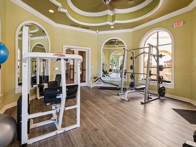 2733 Via Cipriani Unit 830B, Clearwater, FL 33764 - exercise room with french doors, ornamental molding, wood finished floors, and arched walkways