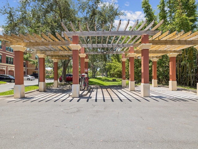 2733 Via Cipriani Unit 830B, Clearwater, FL 33764 - view of patio / terrace featuring a pergola