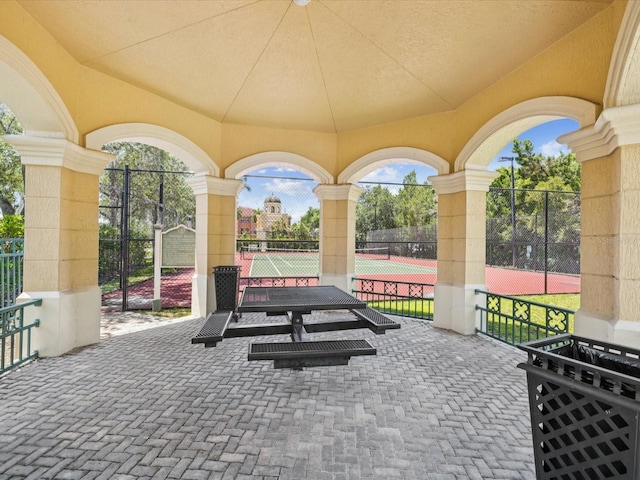 2733 Via Cipriani Unit 830B, Clearwater, FL 33764 - view of patio / terrace featuring a tennis court