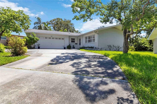 917 Pineview Ave, Clearwater, FL 33756 - ranch-style house with concrete driveway and a garage
