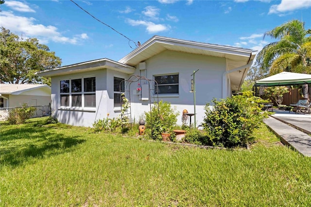 917 Pineview Ave, Clearwater, FL 33756 - view of front facade featuring stucco siding, a gazebo, and a carport