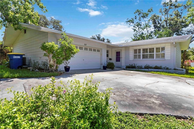 917 Pineview Ave, Clearwater, FL 33756 - ranch-style house with concrete driveway and a garage
