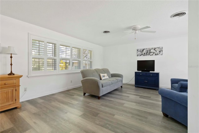 917 Pineview Ave, Clearwater, FL 33756 - living area featuring a ceiling fan and wood finished floors
