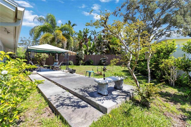 917 Pineview Ave, Clearwater, FL 33756 - fenced backyard featuring a gazebo and a patio area