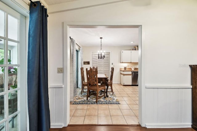 6642 Parson Brown Dr, Orlando, FL 32819 - dining area with light tile patterned flooring and a chandelier