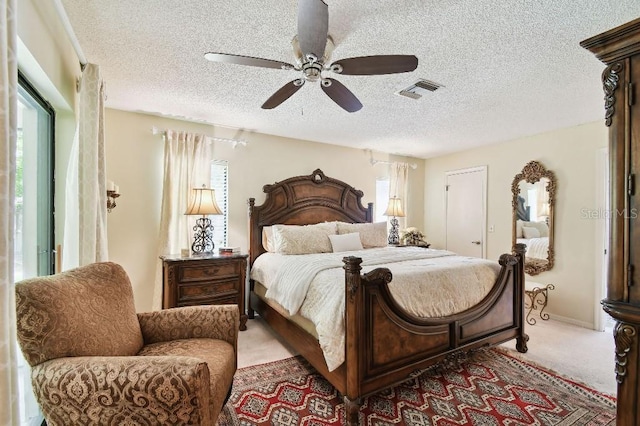 6642 Parson Brown Dr, Orlando, FL 32819 - carpeted bedroom with a textured ceiling and ceiling fan