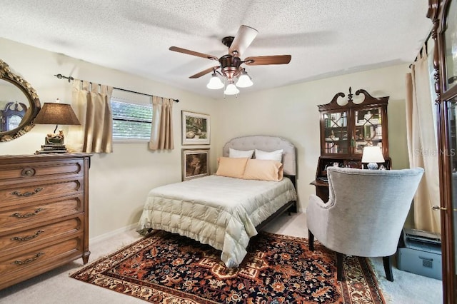 6642 Parson Brown Dr, Orlando, FL 32819 - bedroom with light carpet, a textured ceiling, and ceiling fan