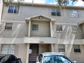 14442 Reuter Strasse Cir Unit 812, Tampa, FL 33613 - view of property featuring stucco siding