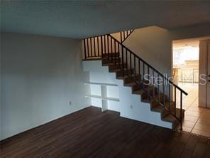 14442 Reuter Strasse Cir Unit 812, Tampa, FL 33613 - staircase with wood finished floors