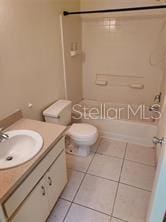 14442 Reuter Strasse Cir Unit 812, Tampa, FL 33613 - full bath with vanity, tile patterned flooring, and bathtub / shower combination