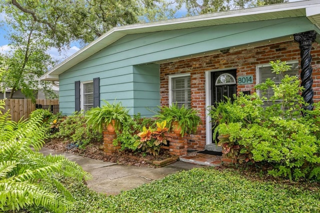 8014 27th Ave N, Saint Petersburg, FL 33710 - view of exterior entry featuring brick siding