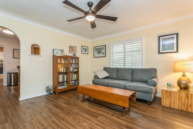 8014 27th Ave N, Saint Petersburg, FL 33710 - living area featuring arched walkways, a ceiling fan, wood finished floors, and crown molding