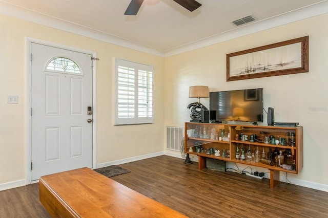 8014 27th Ave N, Saint Petersburg, FL 33710 - entryway featuring wood finished floors, a ceiling fan, and crown molding