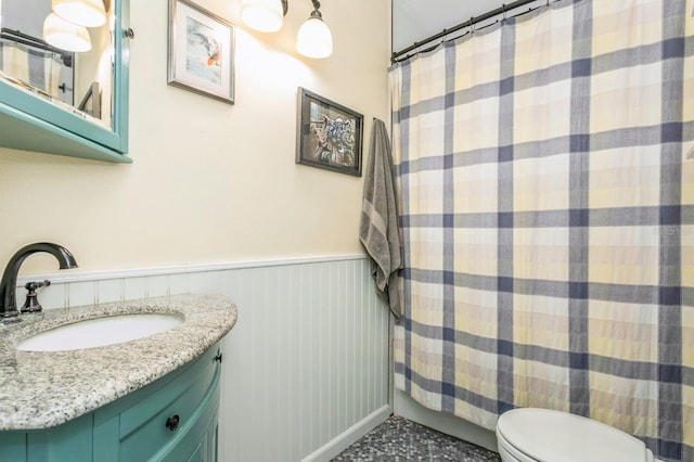 8014 27th Ave N, Saint Petersburg, FL 33710 - bathroom featuring a wainscoted wall, vanity, and a shower with shower curtain