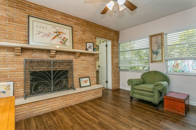 8014 27th Ave N, Saint Petersburg, FL 33710 - living area featuring a fireplace, wood finished floors, ceiling fan, and brick wall