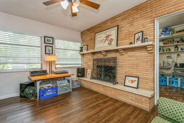 8014 27th Ave N, Saint Petersburg, FL 33710 - living area featuring ceiling fan, a brick fireplace, and wood finished floors
