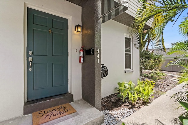 441 75th Ave N, Saint Petersburg, FL 33702 - doorway to property with stucco siding