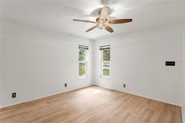 441 75th Ave N, Saint Petersburg, FL 33702 - unfurnished room with light wood finished floors, a ceiling fan, and a textured ceiling