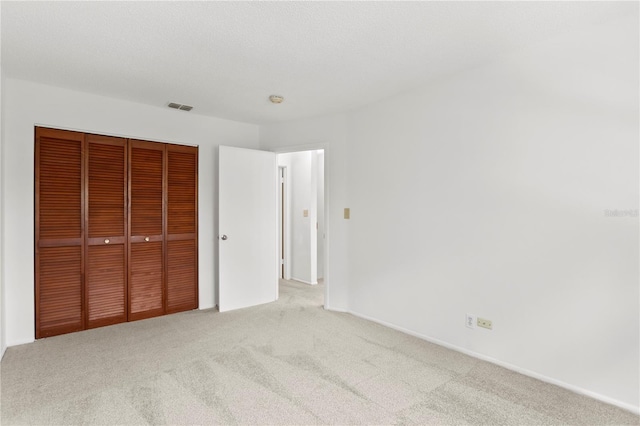 441 75th Ave N, Saint Petersburg, FL 33702 - unfurnished bedroom featuring carpet flooring and a closet