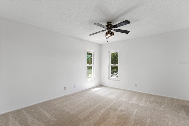 441 75th Ave N, Saint Petersburg, FL 33702 - unfurnished room featuring light carpet, a ceiling fan, and a textured ceiling