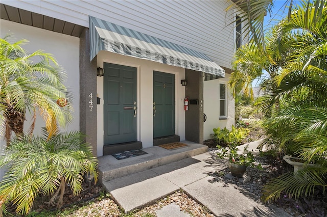 441 75th Ave N, Saint Petersburg, FL 33702 - entrance to property featuring stucco siding