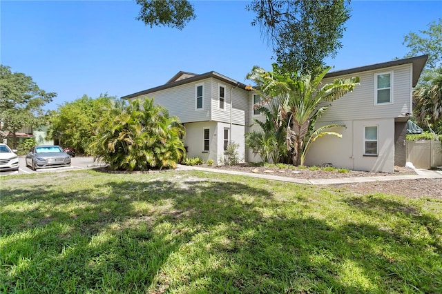 441 75th Ave N, Saint Petersburg, FL 33702 - view of front of home featuring stucco siding and a front lawn