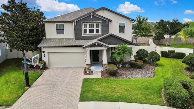 1669 Feather Grass Loop, Lutz, FL 33558 - view of front of house featuring decorative driveway, an attached garage, stucco siding, and a shingled roof