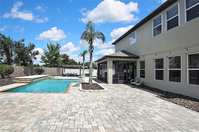 1669 Feather Grass Loop, Lutz, FL 33558 - view of pool with a sunroom, a fenced backyard, and a patio