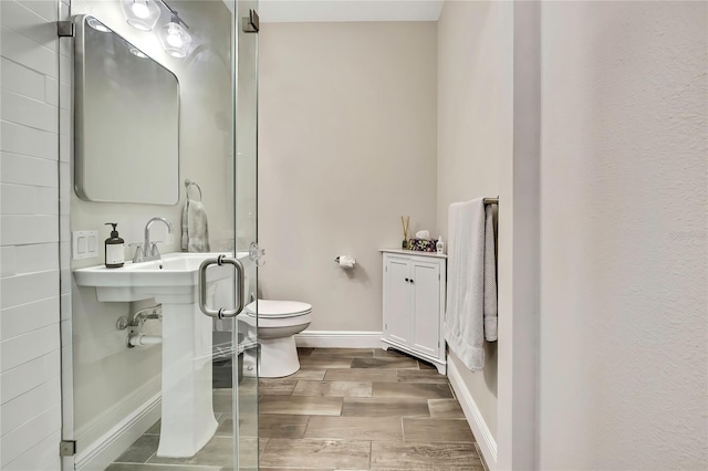 1669 Feather Grass Loop, Lutz, FL 33558 - bathroom with toilet and wood finished floors