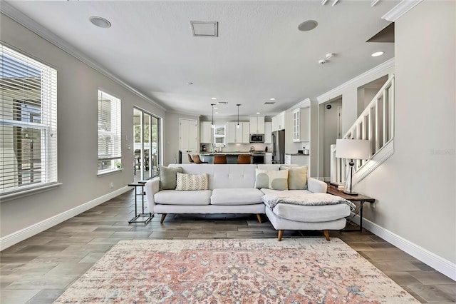 1669 Feather Grass Loop, Lutz, FL 33558 - living area featuring crown molding, wood finished floors, and recessed lighting