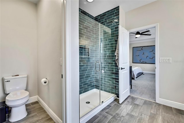 1669 Feather Grass Loop, Lutz, FL 33558 - full bathroom featuring a shower stall, wood finished floors, ensuite bath, and a ceiling fan