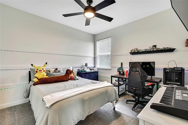 1669 Feather Grass Loop, Lutz, FL 33558 - bedroom featuring a desk, ceiling fan, and radiator